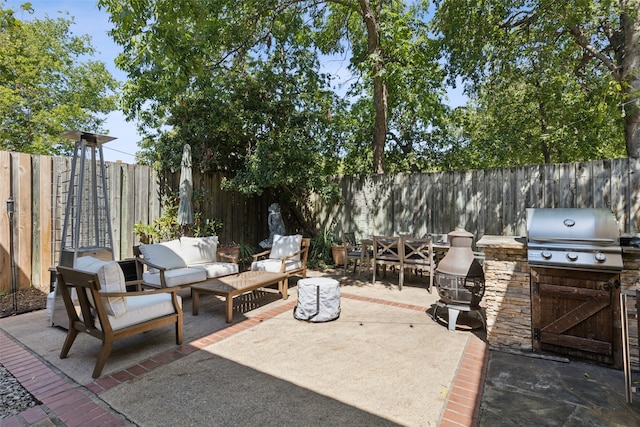 view of patio featuring outdoor lounge area and an outdoor kitchen