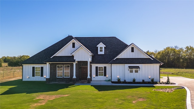 modern farmhouse with a front lawn