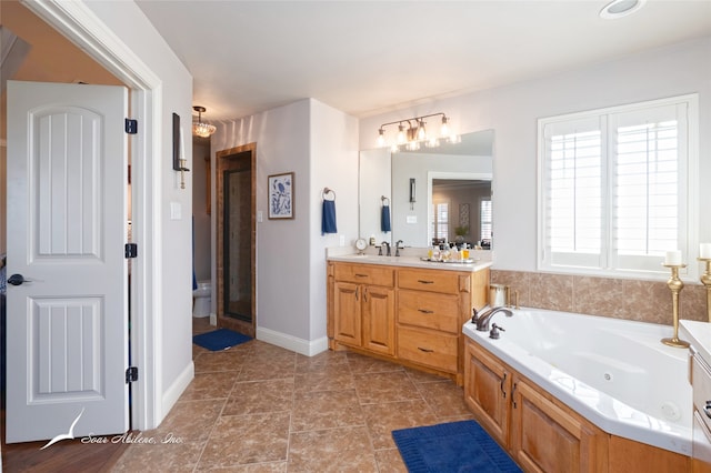 bathroom featuring a bathtub, tile patterned floors, and vanity