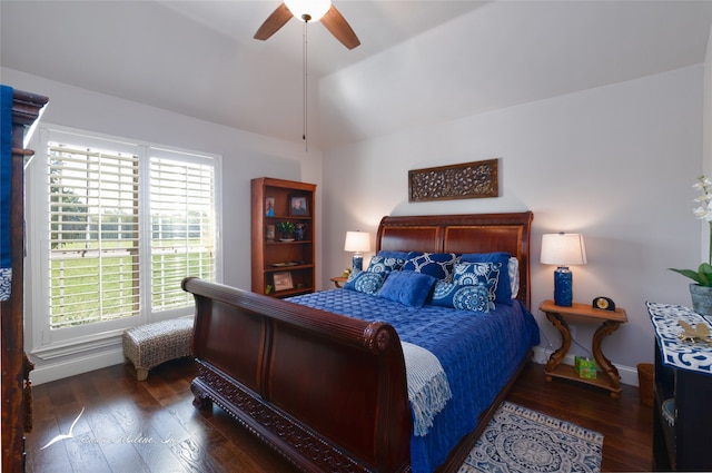 bedroom featuring ceiling fan, lofted ceiling, and dark wood-type flooring