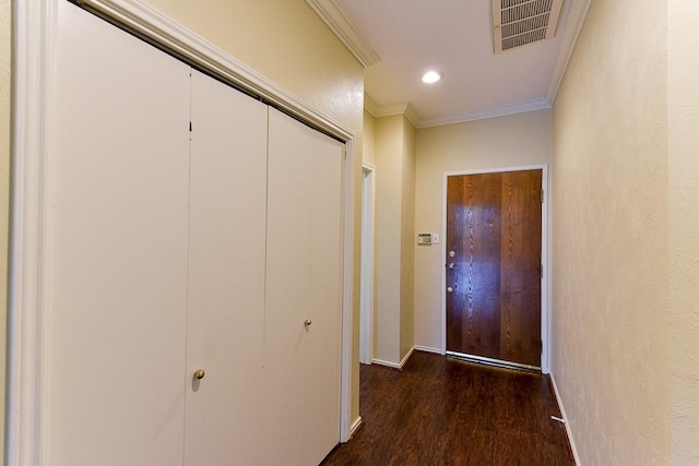 corridor featuring dark wood-type flooring and ornamental molding