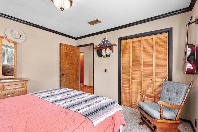 bedroom featuring a closet, crown molding, and light carpet