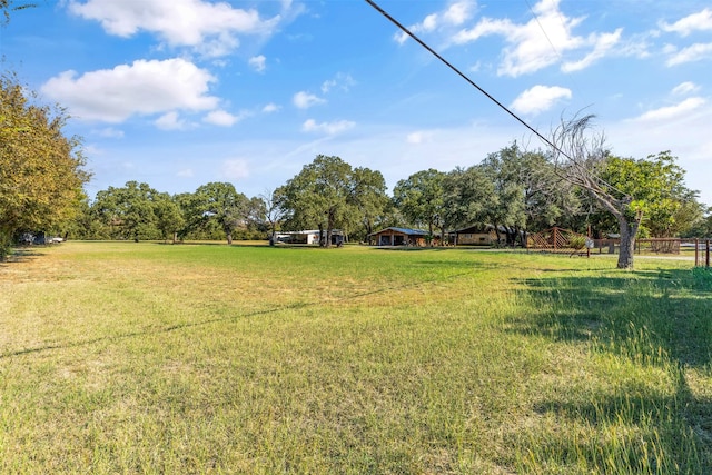 view of yard with a rural view