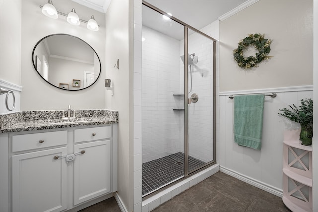 bathroom featuring tile patterned flooring, ornamental molding, a shower with door, and vanity