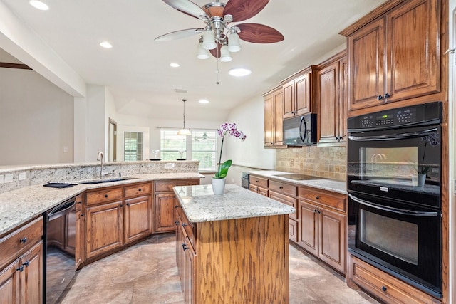 7710 Valley Ridge Dr, Northlake, TX 76247 - kitchen with black appliances, a sink, brown cabinets, ceiling fan, and light stone counters