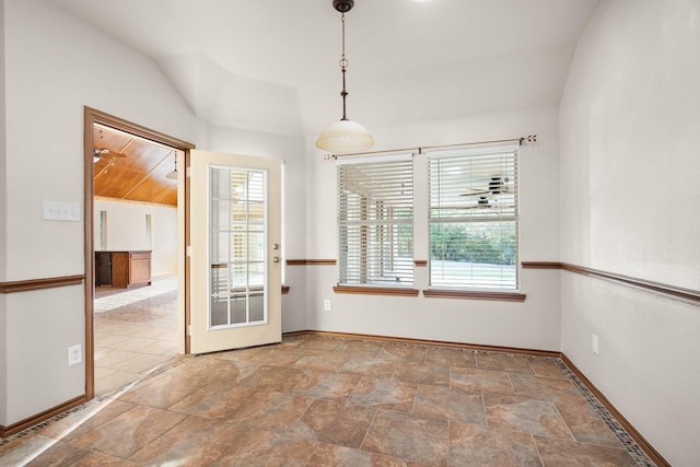 7710 Valley Ridge Dr, Northlake, TX 76247 - unfurnished dining area featuring baseboards, lofted ceiling, and stone finish flooring