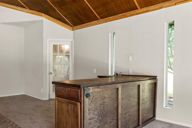 7710 Valley Ridge Dr, Northlake, TX 76247 - bar area with wood ceiling, plenty of natural light, vaulted ceiling, baseboards, and tile patterned floors