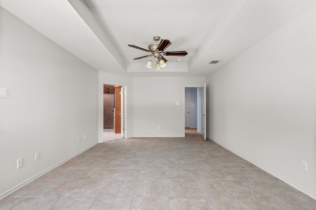 7710 Valley Ridge Dr, Northlake, TX 76247 - unfurnished room featuring ceiling fan, a tray ceiling, and baseboards