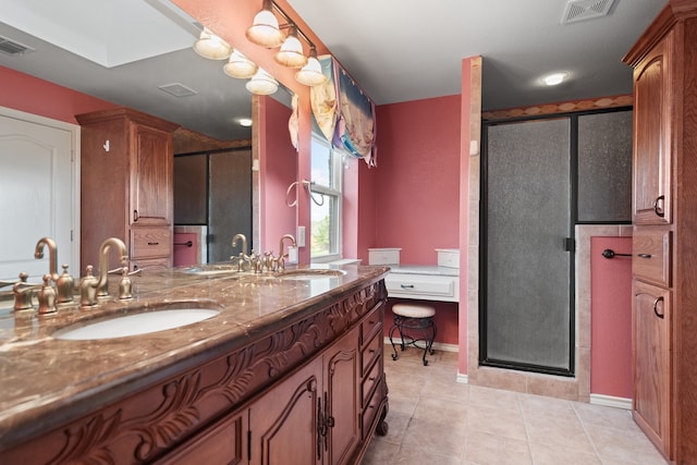 bathroom featuring tile patterned flooring, vanity, and an enclosed shower