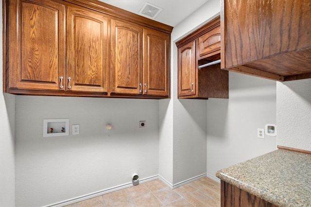 7710 Valley Ridge Dr, Northlake, TX 76247 - laundry room with electric dryer hookup, cabinet space, gas dryer hookup, washer hookup, and baseboards