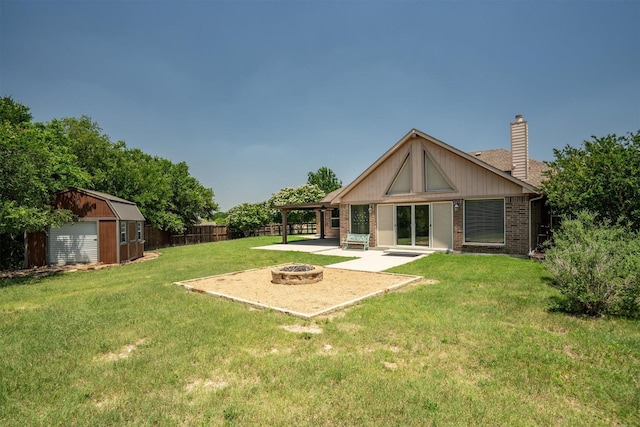 7710 Valley Ridge Dr, Northlake, TX 76247 - rear view of property featuring an outdoor fire pit, a patio, a chimney, and brick siding
