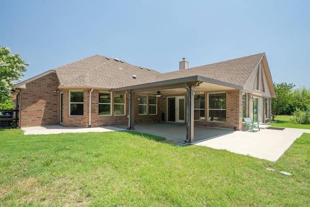 7710 Valley Ridge Dr, Northlake, TX 76247 - rear view of property featuring a patio, brick siding, a lawn, and a chimney
