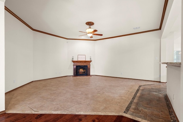 7710 Valley Ridge Dr, Northlake, TX 76247 - unfurnished living room with a ceiling fan, crown molding, baseboards, a lit fireplace, and inlaid floor details
