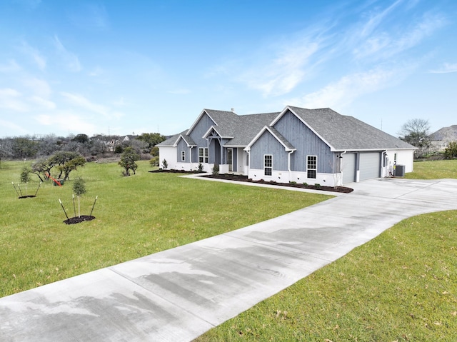 modern inspired farmhouse featuring a front yard, a garage, and central AC