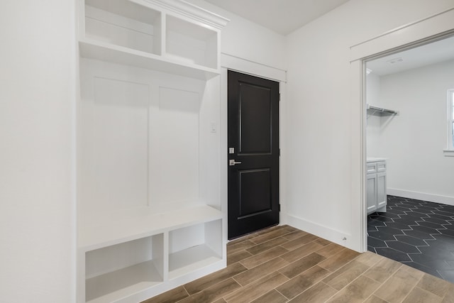 mudroom with dark wood-type flooring