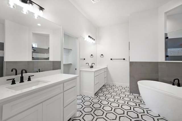 bathroom featuring a bath and vanity