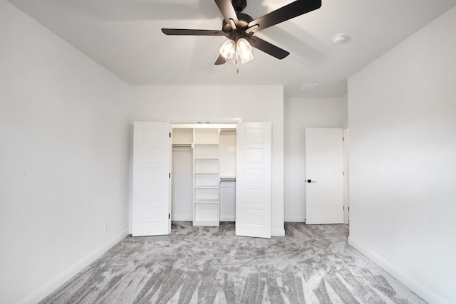 unfurnished bedroom with a closet, light carpet, and ceiling fan