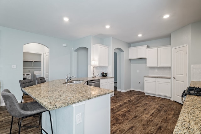 kitchen featuring white cabinetry, sink, stainless steel appliances, and dark hardwood / wood-style floors