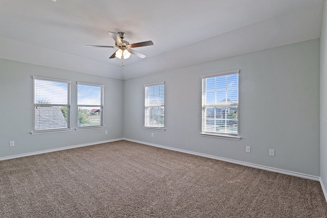 carpeted empty room featuring ceiling fan