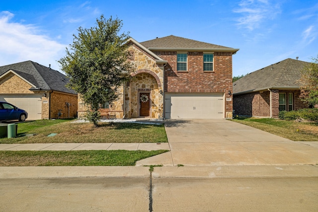 traditional home featuring a garage, brick siding, stone siding, driveway, and a front lawn