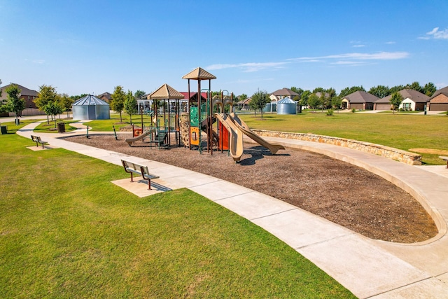 view of playground featuring a lawn