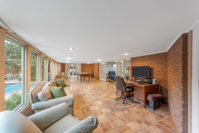 office space featuring french doors and brick wall