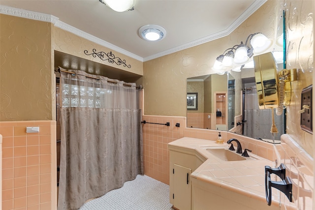 bathroom featuring vanity, ornamental molding, a shower with curtain, and tile walls