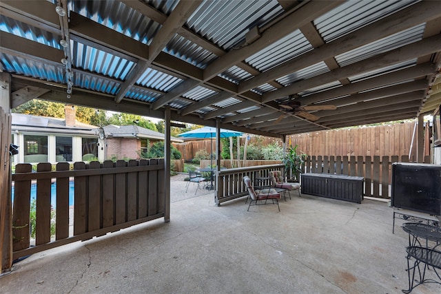 view of patio / terrace with a pergola and ceiling fan