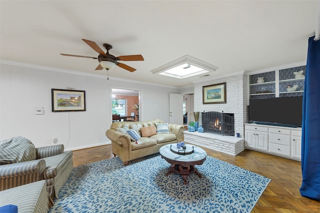 living room with ornamental molding, a fireplace, dark parquet flooring, and ceiling fan