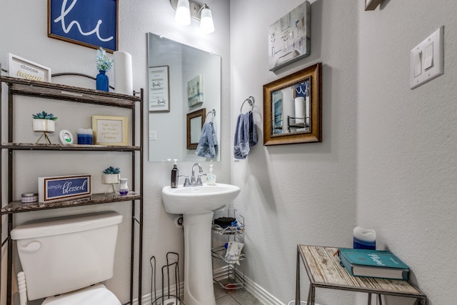 bathroom featuring sink and toilet