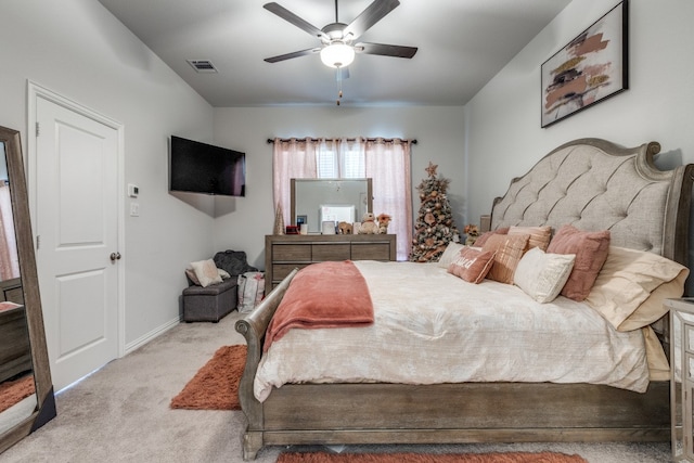 bedroom with light colored carpet and ceiling fan