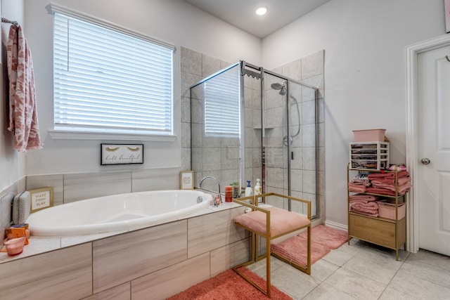 bathroom featuring plus walk in shower and tile patterned floors