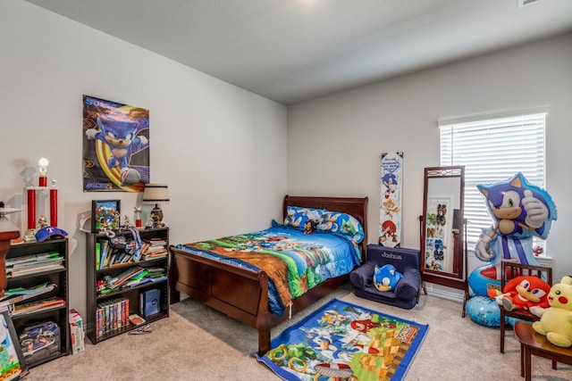 bedroom with light colored carpet