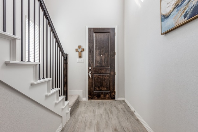 entryway with light hardwood / wood-style floors