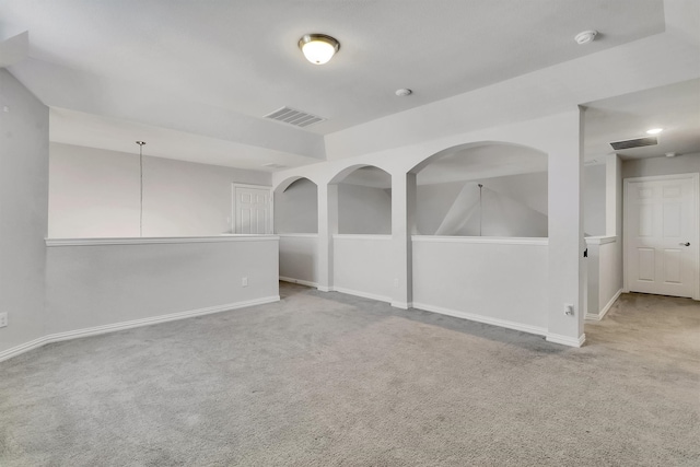 spare room featuring light colored carpet