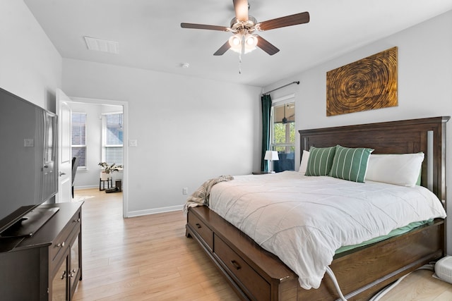 bedroom featuring light wood-type flooring and ceiling fan