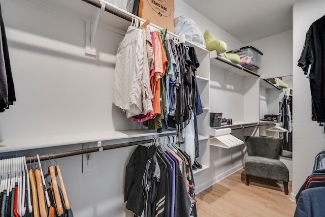 spacious closet with light hardwood / wood-style floors