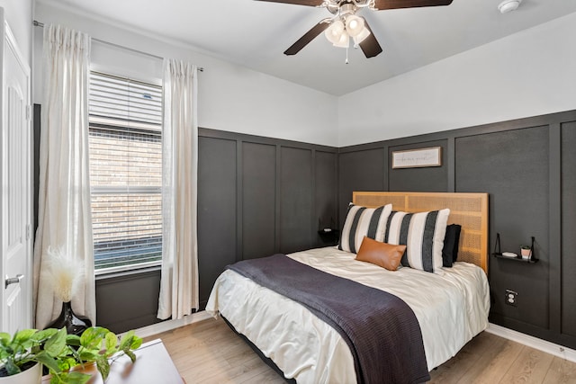 bedroom featuring light wood-type flooring and ceiling fan