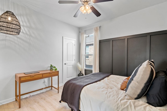 bedroom featuring ceiling fan and light hardwood / wood-style flooring