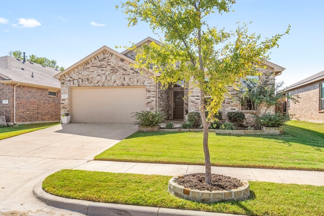 view of front of home featuring a front yard and a garage