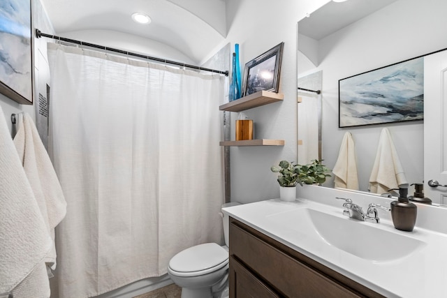 bathroom with vanity, toilet, and a shower with shower curtain