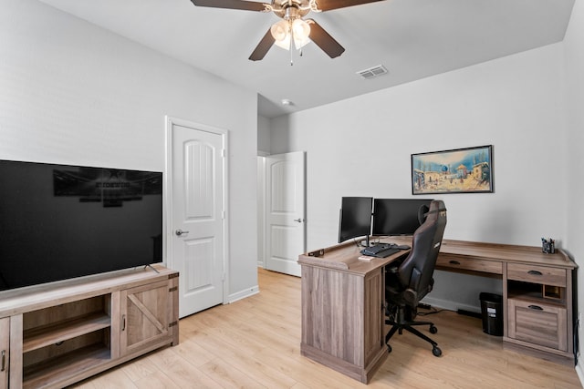 home office featuring ceiling fan and light hardwood / wood-style flooring