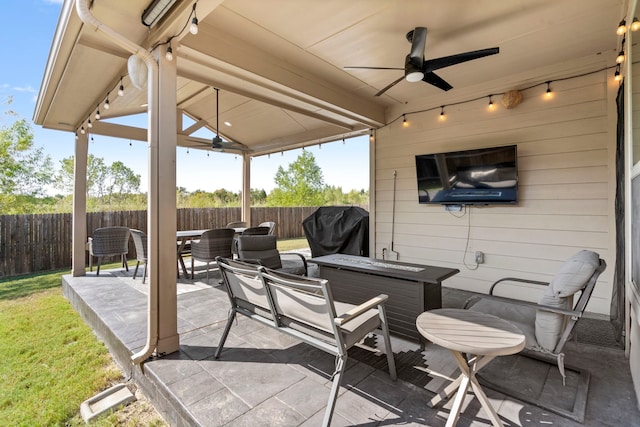 view of patio featuring ceiling fan, grilling area, and outdoor lounge area