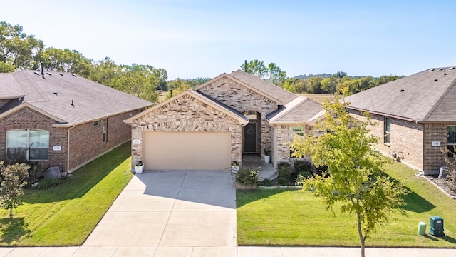 view of front of property with a garage and a front yard