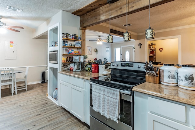 kitchen featuring hanging light fixtures, a textured ceiling, white cabinetry, electric stove, and light hardwood / wood-style floors