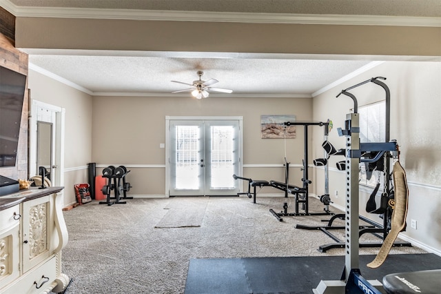 workout area featuring ceiling fan, french doors, crown molding, carpet, and a textured ceiling