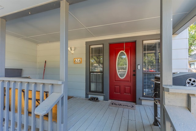 property entrance featuring covered porch