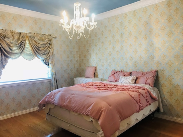 bedroom with ornamental molding, a notable chandelier, and dark hardwood / wood-style floors