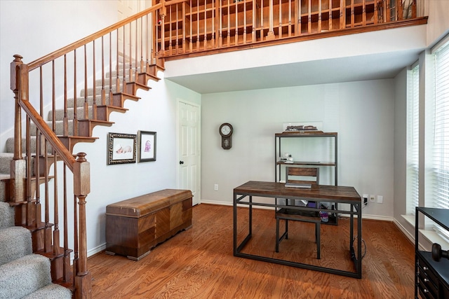 staircase featuring wood-type flooring