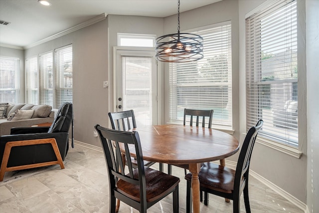 dining space with a notable chandelier and ornamental molding